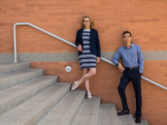 Two students standing on steps outside Eller